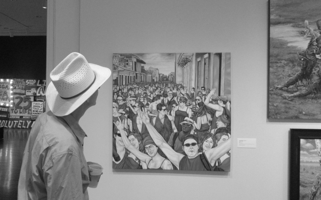 A man views an oil painting in a museum